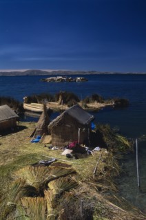 PERU, Puno, Lake Titicaca, Reed houses on floating islands built by the Uros people.