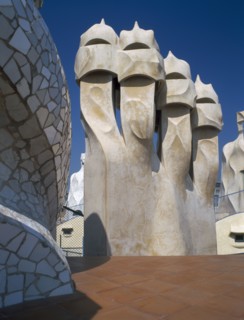 SPAIN, Catalonia, Barcelona, "La Pedrera.  Gaudi architecture, carved chimney pots on the rooftop."