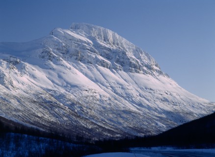NORWAY, Troms, Lavangsdalen, Snow covered mountainside.