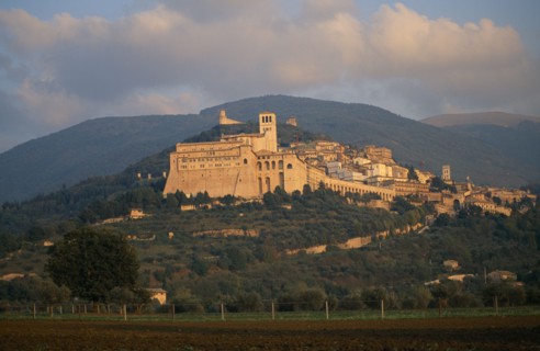 ITALY, Umbria, Assisi, View of the Basilica di San Francesco and Assisi on hillside with hills