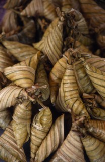 MALAYSIA, Kedah, Langkawi, Pulut a coconut rice dish wrapped in banana leaves on a stall at the