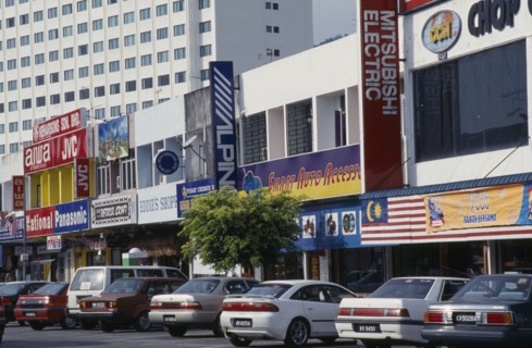 MALAYSIA, Kedah, Langkawi, Kuah old town electrical goods shops with cars parked in front