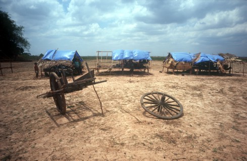 CAMBODIA, Kompong Thom, "Phnom Prasat refugee camp on national Route 6, people just visible in