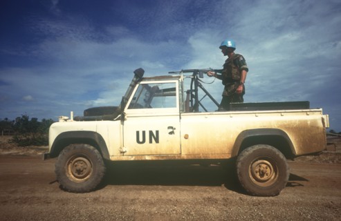 CAMBODIA, Thmar Pouk, Dutch made UN jeep with a soldier standing behind a mounted rifle in the back