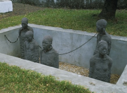 TANZANIA, Zanzibar Island, Zanzibar, Stone Town. Sculpture depicting five slaves chained in a pit