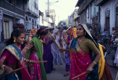 INDIA, Gujarat, Bhavnagar, Hindu wedding with women doing a traditional dance with sticks in the