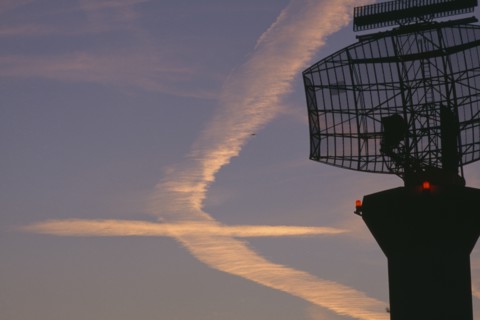 TRANSPORT, Air, Airport, Radar scanner in the foreground  at London Heathrow with vapour trails in