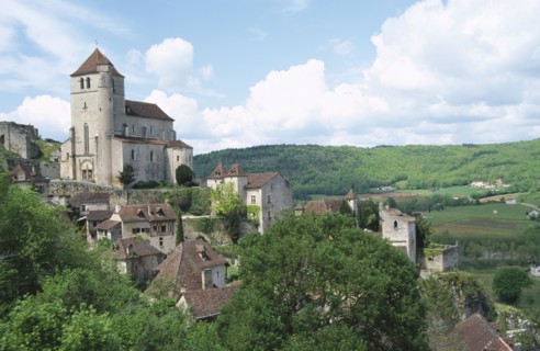 FRANCE, Midi-Pyrenees, Lot, Saint-Cirq-Lapopie.  View over cliff edge village situated above the