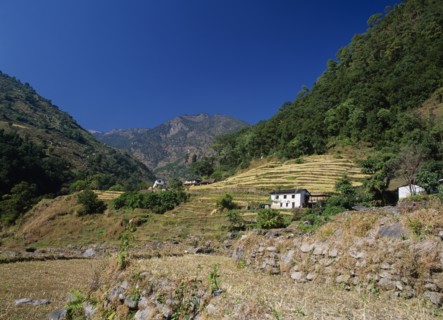 NEPAL, Annapurna Region, Bhurungdi Khola Valley, White painted buildings on lower slopes of