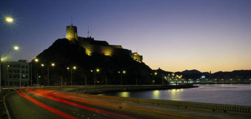 OMAN, Muscat, "Mutrah Fort, built by the Portuguese in the 1580s, situated above town.  Illuminated
