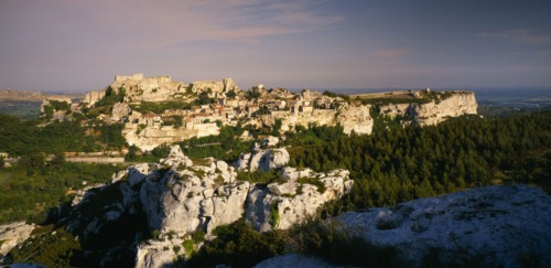 FRANCE, Provence-Cote d’Azur, Les Baux de Provence, View over rocky outcrop towards fortified hill