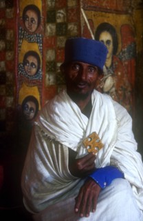 ETHIOPIA, Gonder Province, Gonder, "Church of Debre Birhan Selasie.  Portrait of priest in front of