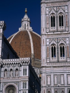 ITALY, Tuscany, Florence, The Duomo.  Part view of the dome seen between the Campanile and facade