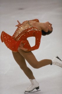 20014978 SPORT Winter Ice Skating Female ice skater on  one skate with back arched