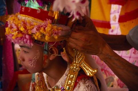 THAILAND, Chiang Mai, Novice monk at ordination ceremony at Wat Chiang Yuen having ornate head