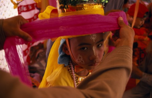 THAILAND, Chiang Mai, Novice monk at ordination ceremony at Wat Chiang Yuen having ornate head