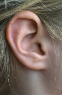 HEALTH, Hearing, Close view of the ear of a seven year old girl.