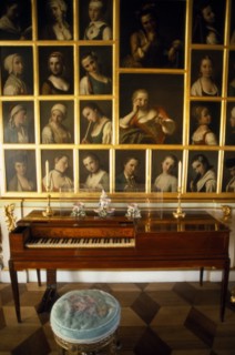 RUSSIA, St Petersburg, Peterhof, Great Palace.  Interior of state room with piano and portraits.