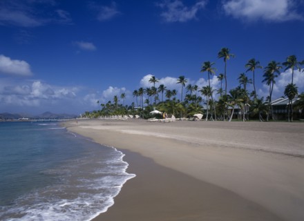 WEST INDIES, Nevis, Pinneys Beach, Four Seasons Resort.  Quiet sandy beach at the waters edge.