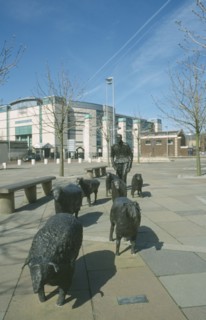 IRELAND, North, Belfast, "Shepherd and Sheep sculpture by artist Deborah Brown, in the grounds of