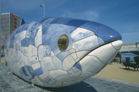 IRELAND, North, Belfast, Sculpture of fish next to Lagan Weir footbridge. Designs use Lasertran