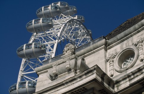 ENGLAND, London, The British Airways London Eye or Millennium Wheel.  Part view seen behind corner