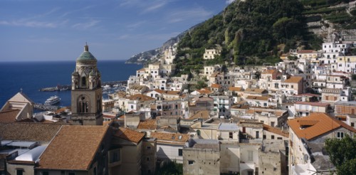 ITALY, Campania, Amalfi , View over red tiled roof tops of the town with the Duomo bell tower on