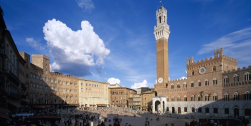 ITALY, Tuscany, Siena, Piazza del Campo.  View across busy piazza lined with bars and cafes and the