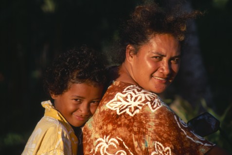 PACIFIC ISLANDS, Cook Islands, Aitutaki , Near Vaipae. Portrait of smiling mother and daughter