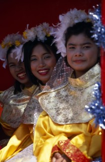 THAILAND, North, Chiang Mai, Chinese new Year procession three smiling girls on float