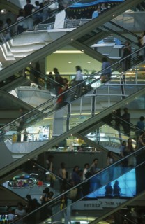 THAILAND, Bangkok, People on escalators inside the MBK Ma Boon Krong Shopping Center