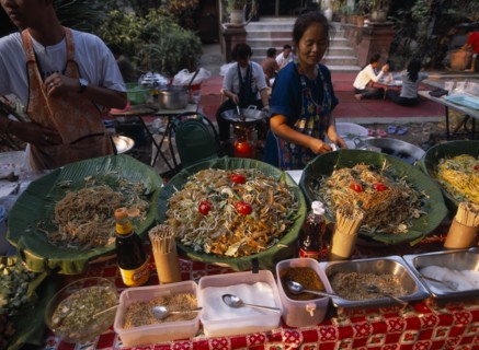 THAILAND, North, Chiang Mai, Wat Chettawan temple grounds with traditional Northern Thai food being