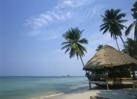THAILAND, Trat Province, Koh Chang, Kai Bae Beach with thatched hut restaurant at the waters edge.