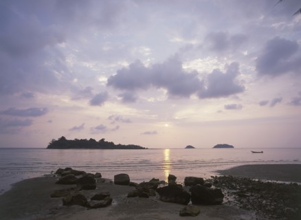 THAILAND, Trat Province, Koh Chang, "Kai Bae Beach view of sunset over Koh Man Nai, Koh Man Nok and