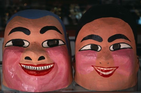 THAILAND, North, Chiang Mai, Chinese New Year.  Close view of two character masks worn during