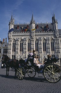 BELGIUM, West Flanders, Bruges, Tourist horse and carriage outside the Stadhuis in Burg Square