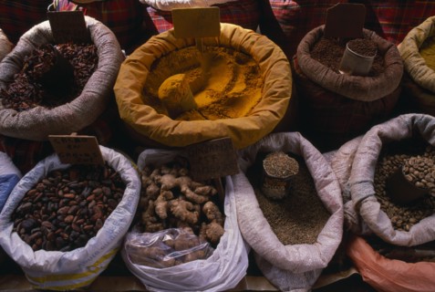 WEST INDIES, Guadeloupe, Grande-Terre, Pointe-à-Pitre.  Sacks of spices displayed on maket stall.
