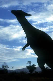 CUBA, Santiago de Cuba, Baccanao, Life size dinosaur silhouetted in amusement park