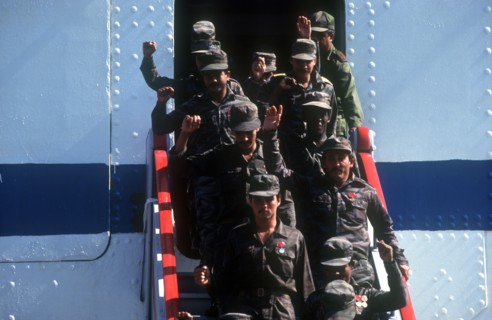 CUBA, Military, Waving soldiers returning from Angola walking down the gangway from a ship