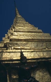 THAILAND, Bangkok, Grand Palace, Wat Phra Kaew. Looking up to detail of statue standing under