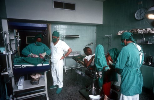CUBA, Havana, Maternity Hospital, Doctors and nurses with a mother who has just given birth and her