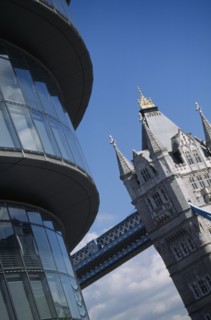 ENGLAND, London, "City Hall, detail of the curved exterior and Tower Bridge in the background"
