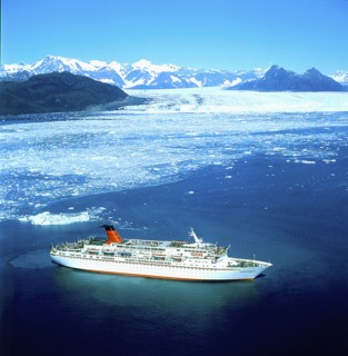 USA, Alaska, Cruise ship below glacier