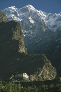 PAKISTAN, Northern Areas, Hunza Valley, "Baltit  Fort built on a cliff side with snow covered peaks
