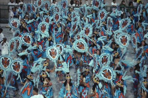 BRAZIL, Rio de Janeiro, Carnival procession of dancers dressed in feathered costumes