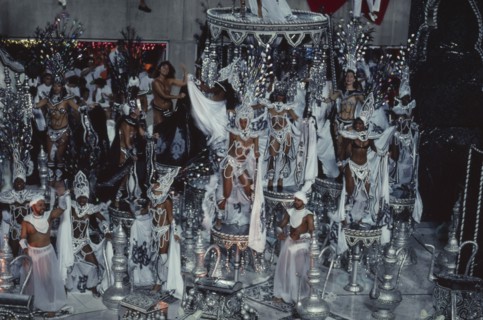 BRAZIL, Rio de Janeiro, Carnival float carrying dancers wearing white beaded costumes