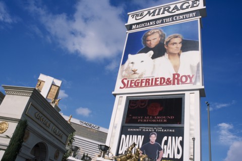 USA, Nevada, Las Vegas, Mirage hotel and casino with signs for Caesar’s Palace with Siegfried & Roy