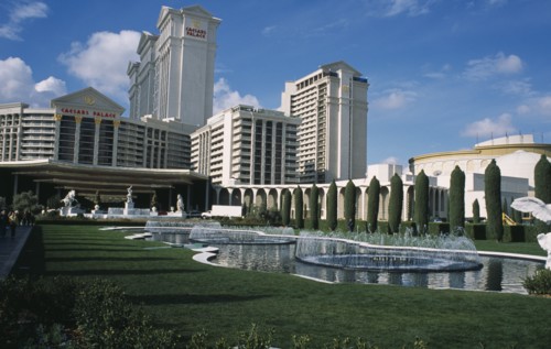 USA, Nevada, Las Vegas, Caesar’s Palace hotel and casino with lawns and fountains in the foreground