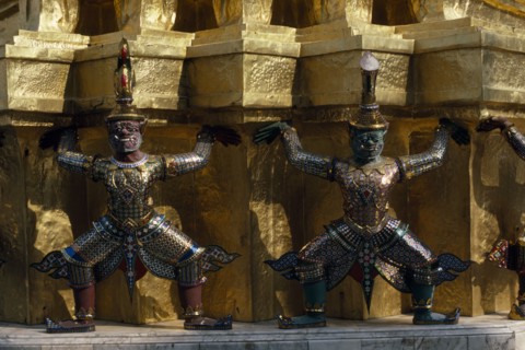 THAILAND, Bangkok, Grand Palace, Wat Phra Kaew. Detail of elaborate exterior with statues