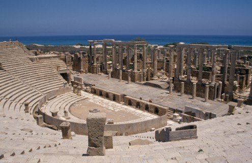 LIBYA, Tripolitania, Leptis Magna, View over Roman amphitheatre towards the Mediterranean Sea